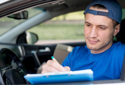 delivery-man-signing-paper_23-2148546130