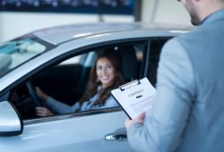 happy-customer-buying-new-car-vehicle-dealership_342744-743